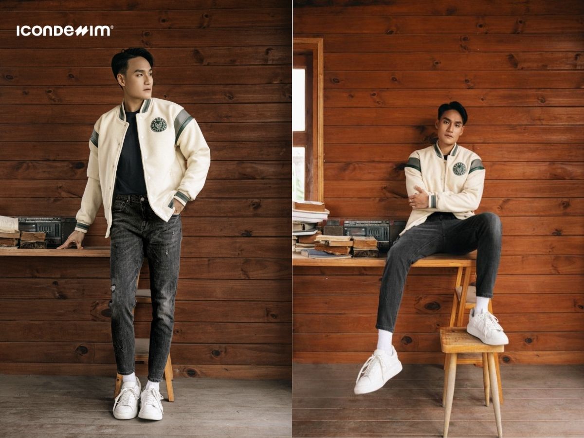 Mix áo khoác varsity jacket màu be với quần jeans đen xám